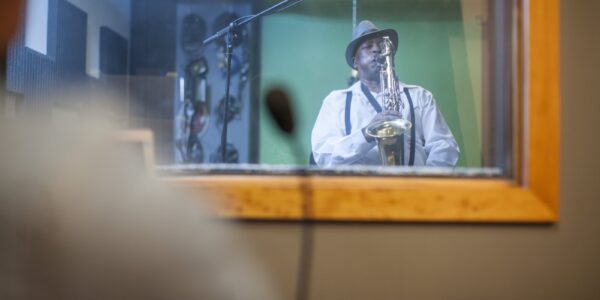 male-musician-in-recording-studio-playing-saxopho-2024-06-17-18-30-43-utc
